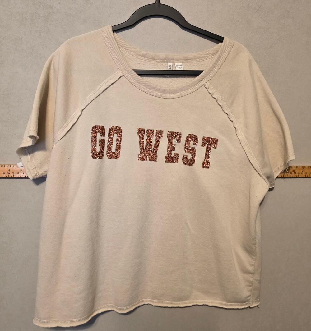 NWOT Cato cream short sleeve sweatshirt with bronze sequin "GO WEST" size 14/16